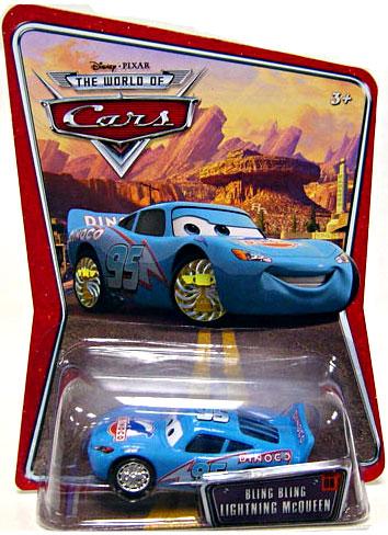 Cars (Auta) - Bling Bling McQueen (Blesk Dinoco) World Of Cars - výrazně poškozený obal
